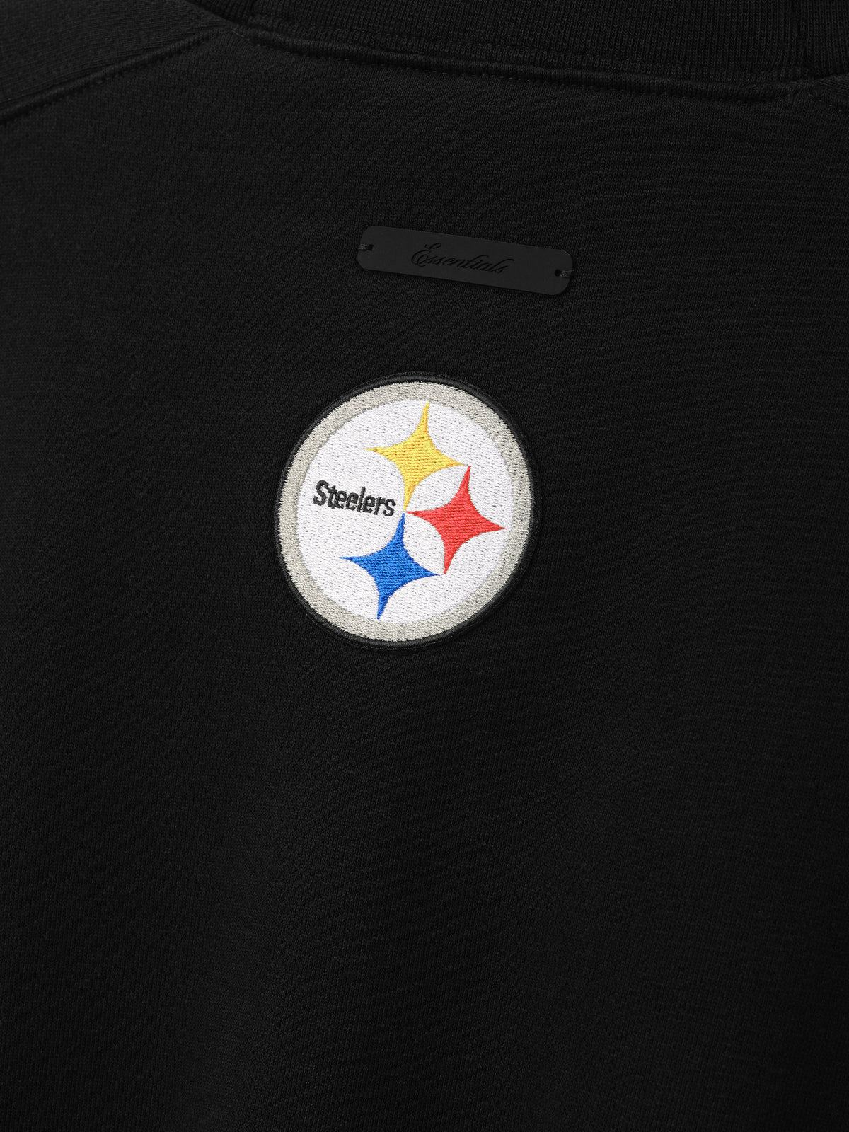 Buzo Fear of God Essentials Steelers 90s Relaxed Negro